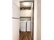 Convenient laundry area with modern washer, dryer, storage, and wood-look flooring at 5582 Brady Dr, Stone Mountain, GA 30087