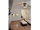 Cozy living room with wood-look floors, stylish lighting, and comfortable white seating at 5582 Brady Dr, Stone Mountain, GA 30087