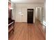 Hardwood floors, built-in bookcase, and adjacent entry, offering both style and functionality at 5582 Brady Dr, Stone Mountain, GA 30087