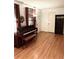 Cozy living room featuring hardwood floors, piano, and a 'DREAM' bookshelf, creating a warm atmosphere at 5582 Brady Dr, Stone Mountain, GA 30087