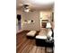 Bright living area with wood-look flooring, a view of the kitchen, and modern decor at 5582 Brady Dr, Stone Mountain, GA 30087