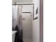 A clean, tiled shower featuring a shower curtain with a tree pattern at 5582 Brady Dr, Stone Mountain, GA 30087