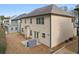 Expansive backyard featuring a covered grill, well-maintained lawn, and exterior of a two-story home at 2126 Roberts View Trl, Buford, GA 30519