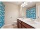 Bathroom featuring a double sink vanity, toilet, and shower with decorative curtain at 2126 Roberts View Trl, Buford, GA 30519