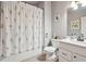Charming bathroom featuring a floral shower curtain and vanity at 2126 Roberts View Trl, Buford, GA 30519