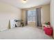 Neutral bedroom features carpet, curtains, a painting, and space for personalization at 2126 Roberts View Trl, Buford, GA 30519