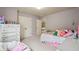 Charming bedroom features neutral walls, carpet, and doorway leading to other rooms at 2126 Roberts View Trl, Buford, GA 30519