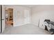 Bedroom featuring neutral walls, carpet, and doorway leading to other rooms in the house at 2126 Roberts View Trl, Buford, GA 30519