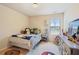 bedroom featuring neutral walls, a window, and decorative touches throughout at 2126 Roberts View Trl, Buford, GA 30519