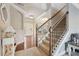 Bright foyer showcases a staircase with iron spindles and an inviting entrance with natural light at 2126 Roberts View Trl, Buford, GA 30519