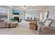 Spacious living area featuring neutral tones, plush seating, and a seamless transition to the backyard at 2126 Roberts View Trl, Buford, GA 30519