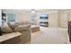 Large living room with a sectional sofa, neutral tones, and recessed lighting at 2126 Roberts View Trl, Buford, GA 30519