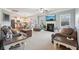 Open-concept living room features a fireplace, recessed lighting, and seamless transition to the kitchen at 2126 Roberts View Trl, Buford, GA 30519