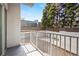 Outdoor balcony with metal railing overlooking trees and a fence at 250 Pharr Ne Rd # 208, Atlanta, GA 30305