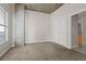 Carpeted bedroom with large windows, a concrete pillar, and a closet for storage at 250 Pharr Ne Rd # 208, Atlanta, GA 30305