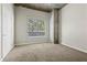 Bedroom with neutral carpet and a large window providing natural light at 250 Pharr Ne Rd # 208, Atlanta, GA 30305