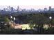 Breathtaking skyline view overlooking a field and treeline offering a picturesque urban view in the distance at 250 Pharr Ne Rd # 208, Atlanta, GA 30305