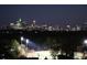 Spectacular night skyline view featuring lit-up buildings and a sports field at 250 Pharr Ne Rd # 208, Atlanta, GA 30305