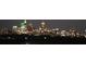 Striking nighttime view of a city skyline with skyscrapers illuminated against the dark sky at 250 Pharr Ne Rd # 208, Atlanta, GA 30305