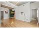 Spacious living area with hardwood floors, a unique lighting fixture, and a decorative wall at 250 Pharr Ne Rd # 208, Atlanta, GA 30305