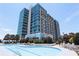 Luxurious swimming pool surrounded by modern high-rise architecture, perfect for relaxing and enjoying the city views at 250 Pharr Ne Rd # 208, Atlanta, GA 30305