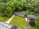 Aerial view of the property with manicured lawn, landscaping, and a detached garage at 2521 Whites Mill Ln, Decatur, GA 30032