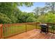 Relax on this refinished back deck with wooded views, perfect for enjoying the outdoors at 2521 Whites Mill Ln, Decatur, GA 30032