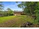 Spacious yard with trees and a deck offers outdoor enjoyment and serene relaxation at 2521 Whites Mill Ln, Decatur, GA 30032