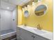 This bathroom features double sinks, white cabinets and a walk-in shower with white subway tile at 2521 Whites Mill Ln, Decatur, GA 30032