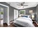 Bedroom with modern decor, ensuite bath, natural light, ceiling fan, and large closets at 2521 Whites Mill Ln, Decatur, GA 30032