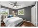 Bedroom with queen size bed, ceiling fan, and windows at 2521 Whites Mill Ln, Decatur, GA 30032