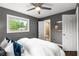 Bright bedroom with ensuite bathroom, ceiling fan, and natural light at 2521 Whites Mill Ln, Decatur, GA 30032