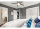 Bright bedroom with ensuite bath featuring neutral decor, ceiling fan, and windows at 2521 Whites Mill Ln, Decatur, GA 30032