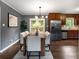 Modern dining room with a stylish light fixture, comfortable seating, and wood floors for elegant dinners at 2521 Whites Mill Ln, Decatur, GA 30032