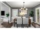Stylish dining room with a contemporary light fixture, ample natural light, and deck access, perfect for entertaining at 2521 Whites Mill Ln, Decatur, GA 30032
