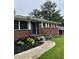 Charming brick home's front entrance with manicured landscaping at 2521 Whites Mill Ln, Decatur, GA 30032
