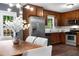 Kitchen with stainless steel appliances, wood cabinets, and eat-in kitchen with deck access, perfect for cooking and dining at 2521 Whites Mill Ln, Decatur, GA 30032