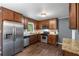 Updated kitchen with stainless steel appliances, granite counters, and dark wood cabinetry at 2521 Whites Mill Ln, Decatur, GA 30032