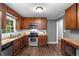 Spacious kitchen boasts granite countertops, stainless appliances, and warm wood cabinets at 2521 Whites Mill Ln, Decatur, GA 30032
