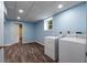Bright laundry room features tile floors, open doorway, and washer and dryer hookups at 2521 Whites Mill Ln, Decatur, GA 30032