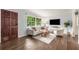 Bright living room with hardwood floors, large windows, and stylish furnishings at 2521 Whites Mill Ln, Decatur, GA 30032