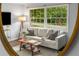 Bright living room featuring hardwood floors, a comfortable couch, and natural light at 2521 Whites Mill Ln, Decatur, GA 30032