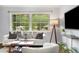 Bright living room with large windows, comfortable seating, and modern decor creating a relaxing atmosphere at 2521 Whites Mill Ln, Decatur, GA 30032
