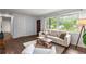 Cozy living room showcasing hardwood floors, a large window, and comfortable seating perfect for relaxation at 2521 Whites Mill Ln, Decatur, GA 30032