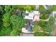 An aerial view showcases the property's lush backyard and a modern pool at 3734 Powers Ferry Nw Rd, Atlanta, GA 30342