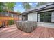 The backyard features a hot tub on a wooden deck, perfect for relaxing and enjoying the outdoors in privacy at 3734 Powers Ferry Nw Rd, Atlanta, GA 30342