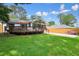 Charming home with a large deck and lush green lawn perfect for outdoor living and enjoyment at 3734 Powers Ferry Nw Rd, Atlanta, GA 30342