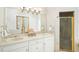 Bright bathroom featuring a double vanity, granite counters, a large mirror, and a separate shower at 3734 Powers Ferry Nw Rd, Atlanta, GA 30342