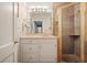 The bathroom has a glass shower, updated fixtures, and ample lighting for a clean, modern feel at 3734 Powers Ferry Nw Rd, Atlanta, GA 30342