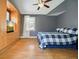 Comfortable bedroom featuring hardwood floors, a built-in dresser, and plenty of natural light at 3734 Powers Ferry Nw Rd, Atlanta, GA 30342